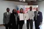 Clive Nyapokoto receiving his award from the Austrian Ambassador to south Africa Ambassador Brigitte Öppinger-Walchshofer